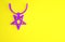 Purple Pentagram on necklace icon isolated on yellow background. Magic occult star symbol. Minimalism concept. 3d