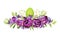 Purple peony tulips, lilac flowers and painted eggs in Easter arrangement