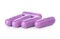 Purple pill capsules on white background