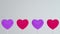 Purple pink hearts on white sticks on white isolated background. Move to the left and rotate