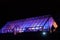 Purple and Pink Lights Illuminating an Alpine Greenhouse.