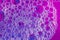 Purple, pink, and magenta bubbles. Close-up abstract graphic background image.