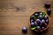 Purple plums in bowl. Plum harvest top view