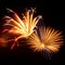 Purple, red, green, and gold fireworks explode during an Independence Day celebration in the United States.