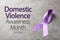 Purple ribbon on background. Symbol of Domestic Violence Awareness