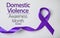 Purple ribbon on background, top view. Symbol of Domestic Violence Awareness