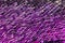 Purple sequins pattern macro view