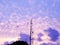 Purple sky with clouds - cell communications tower