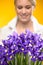 Purple spring iris flowers woman in background