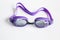 Purple swim goggles on white background