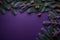 Purple table with Christmas tree branches and cones, a place for text