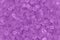 Purple textured beach glass closeup background