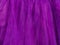 Purple tulle fabric texture top view Violet background Fashion trend color feminine tutu skirt dress flatlay female blog