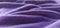 Purple velvet. Soft fabric. Blurred edges of the photo. Soft lilac color, nice fabric texture