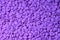 Purple wax granules. Abstract beautiful backdrop.