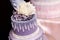 Purple wedding cake decorated with flowers