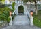 Purple wild pansies in a terracotta planters flanking steps in the Garden of the Villa Cipressi in Varenna.