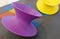 Purple and Yellow Spinning Tops in Kid Playground