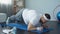 Purposeful overweight man doing plank exercise at home, desire to lose weight