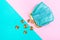 Purse for coins. A leather purse, wallet on a Geometric pink and turquoise background. Trend colors