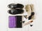 Purse and shoes,gloves, glasses, hair accessories.Stiylish feminine accessories.Black and beige colors. Flat lay,top view. Spring