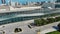 push out aerial footage of the Miami Beach Convention Center with hotels and luxury condominiums in the city skyline