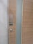 Push type door handle, black text latch in the stainless steel plate and keyhole on wooden door