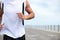 Push your body beyond its limits. Cropped image of a fit and athletic male running on a beach promenade outside -