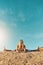 Push yourself to do the impossible. Shot of an athletic young woman practicing yoga on the beach.