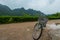 A pushbike parked against the beautiful backdrop of Cat ba Island on Ha Long Bay