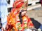 Pushkar, India: A young little girl dressed up or disguised as Indian goddess with crown, red dress and