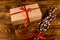 Pussywillow bouquet and cardboard gift box on a wooden table