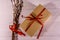 Pussywillow bouquet and cardboard gift box on a wooden table. Top view