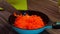 Put grated carrots in the pan