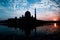 Putra Mosque Silhouette during sunrise with reflection in the lake