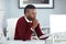 He puts a lot of thought into his work. a young businessman working at his desk in an office.