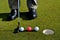 Putter and three golf balls