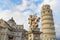 Putti Fountain and Leaning Tower. Pisa, Italy