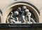 Putti at work: sculptures of cherubs building in arcade, Glasgow