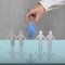 PUtting blue 3D people into hands chain on desk