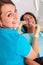 Putting dental braces to the woman`s teeth at the dental office. Dentist examine female patient with braces in dental