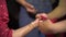 Putting Henna on Bride`s Palm