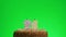 Putting a number twenty six birthday candle on a delicious cake, green screen 26