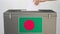 Putting paper ballot into ballot box with flag of Bangladesh. Voting related 3d rendering