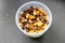 putting yogurt in granola Musli in a bowl,