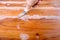 Putty knife on the wooden floor