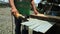 Puyo, Ecuador, 15-4-2019: Person working outdoors with a metal cutting hand saw machine