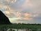 Puzehei Scenic Area at dusk with a serene lake reflecting the countless lotus flowers