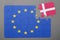 Puzzle with flag of european union and denmark piece detached.