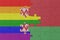 puzzle with the flag of rainbow gay pride and belarus . macro.concept